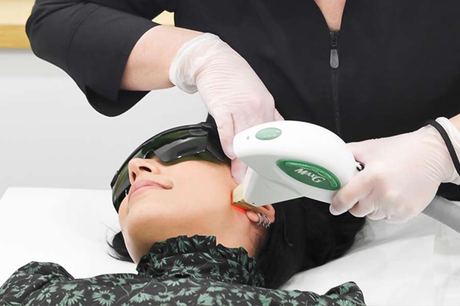 Three for me woman receiving a laser facial thatis actually an IPL photofacial