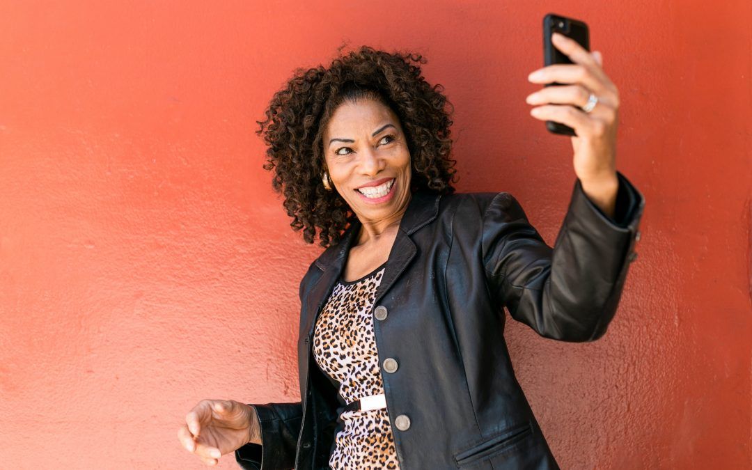 Women holding cell phone