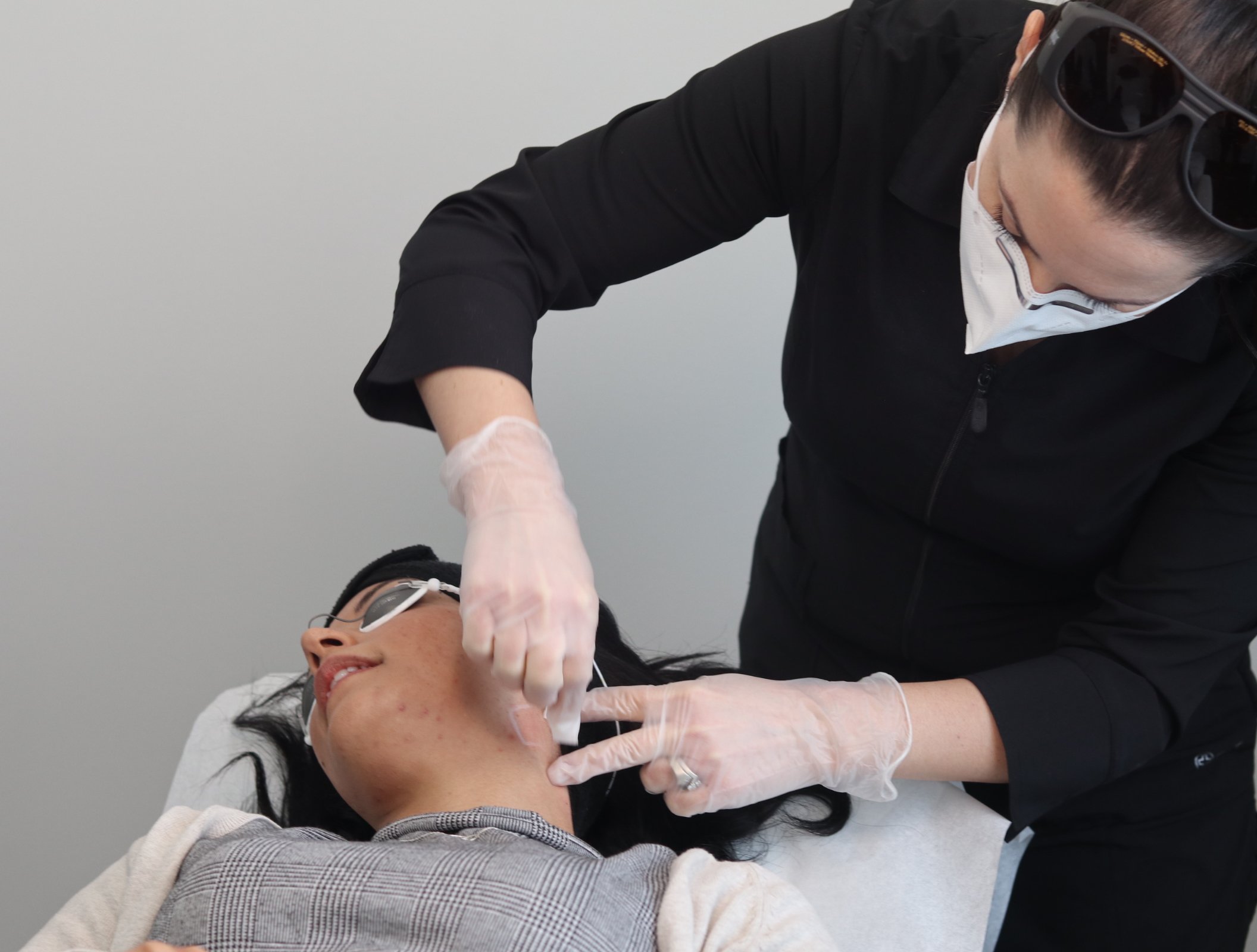 laser picosure acne medspa winnipeg Skin specialist in winnipeg examining a client's skin