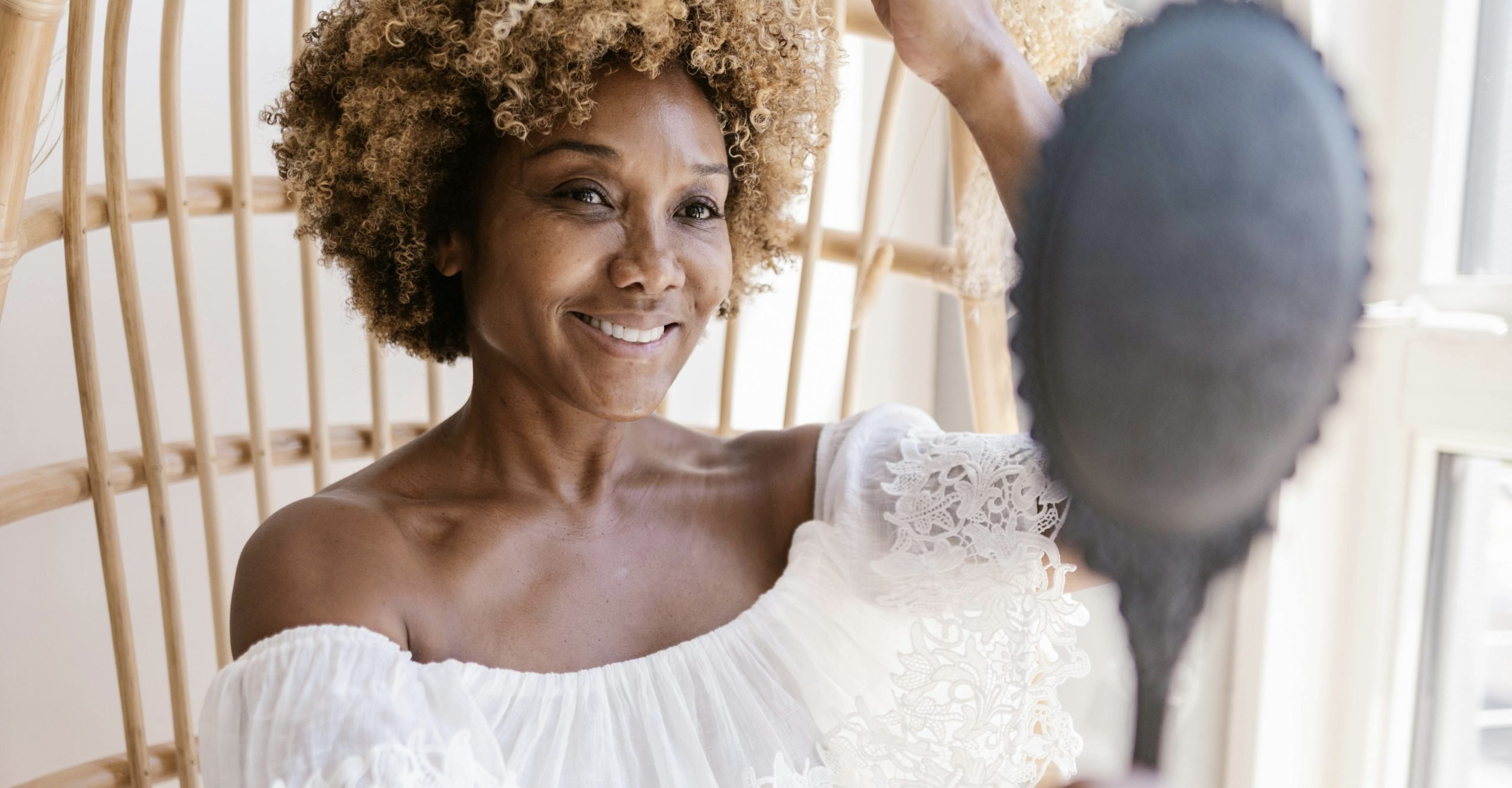 beautiful skin is a combination of a well-rounded routine Woman looking into a mirror