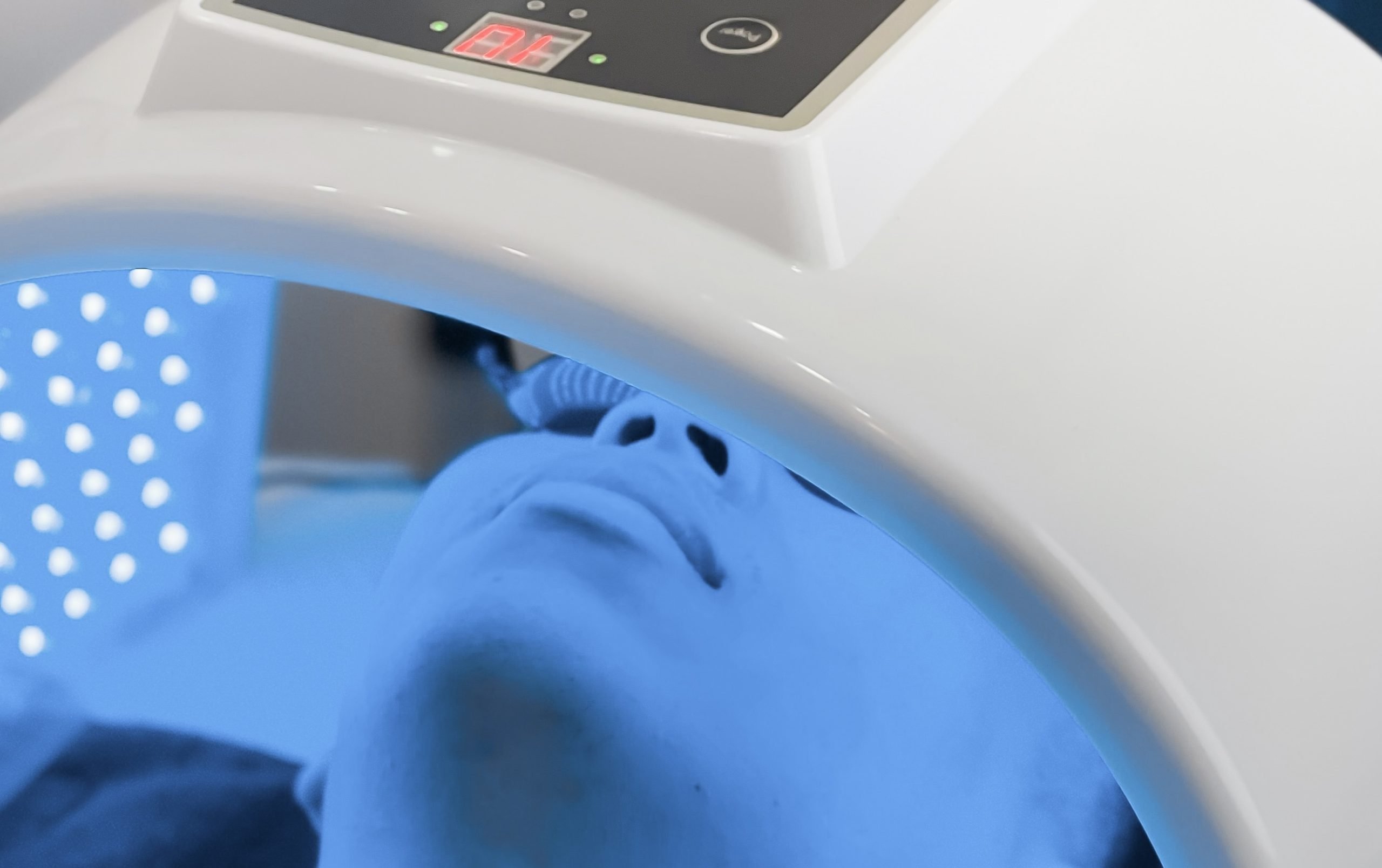 blue light therapy A person receiving blue led light therapy in winnipeg for acne