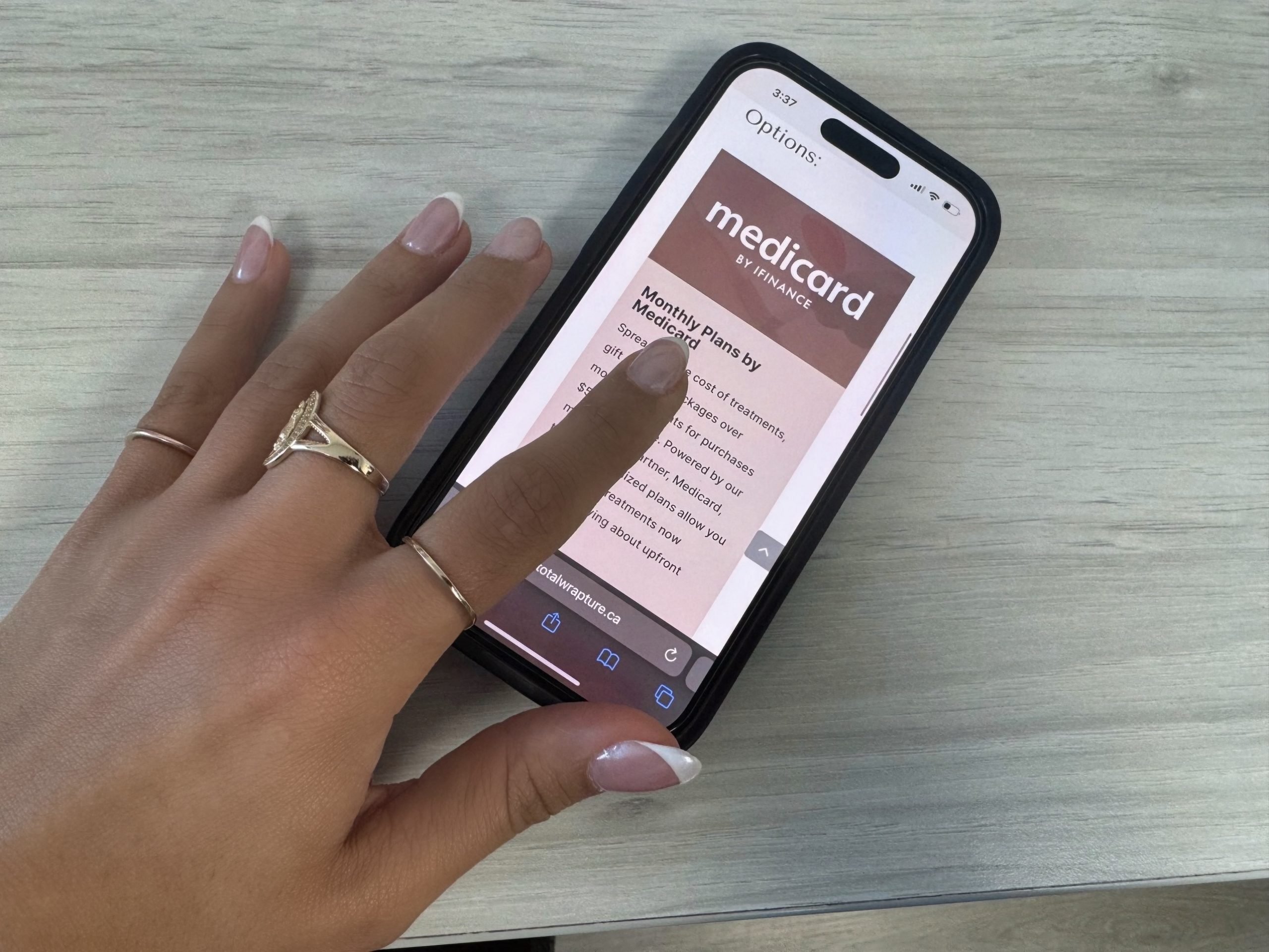 A hand scrolling on a phone