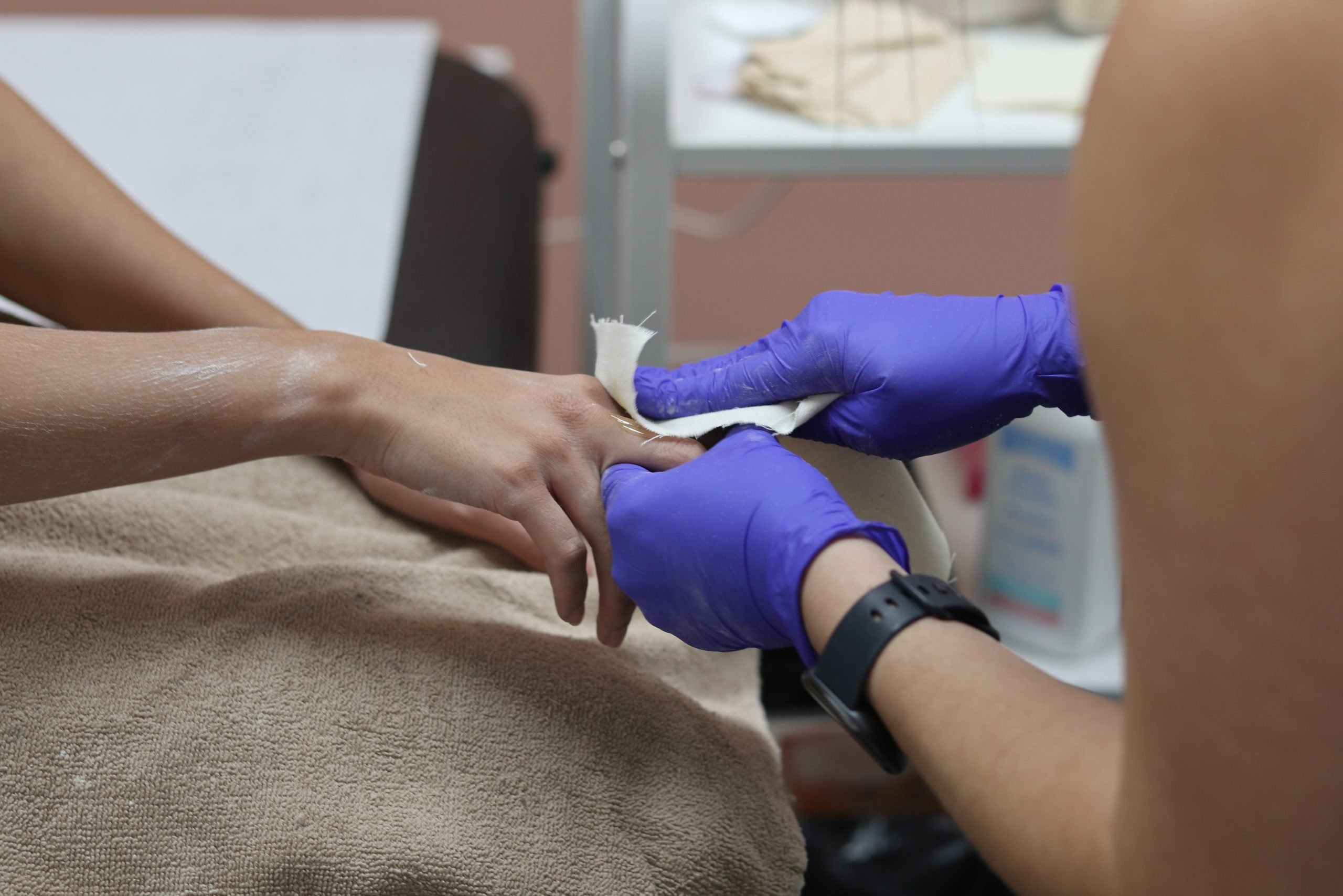 hand waxing winnipeg Winnipeg esthetician performing a hand wax service for a Headingley waxing client