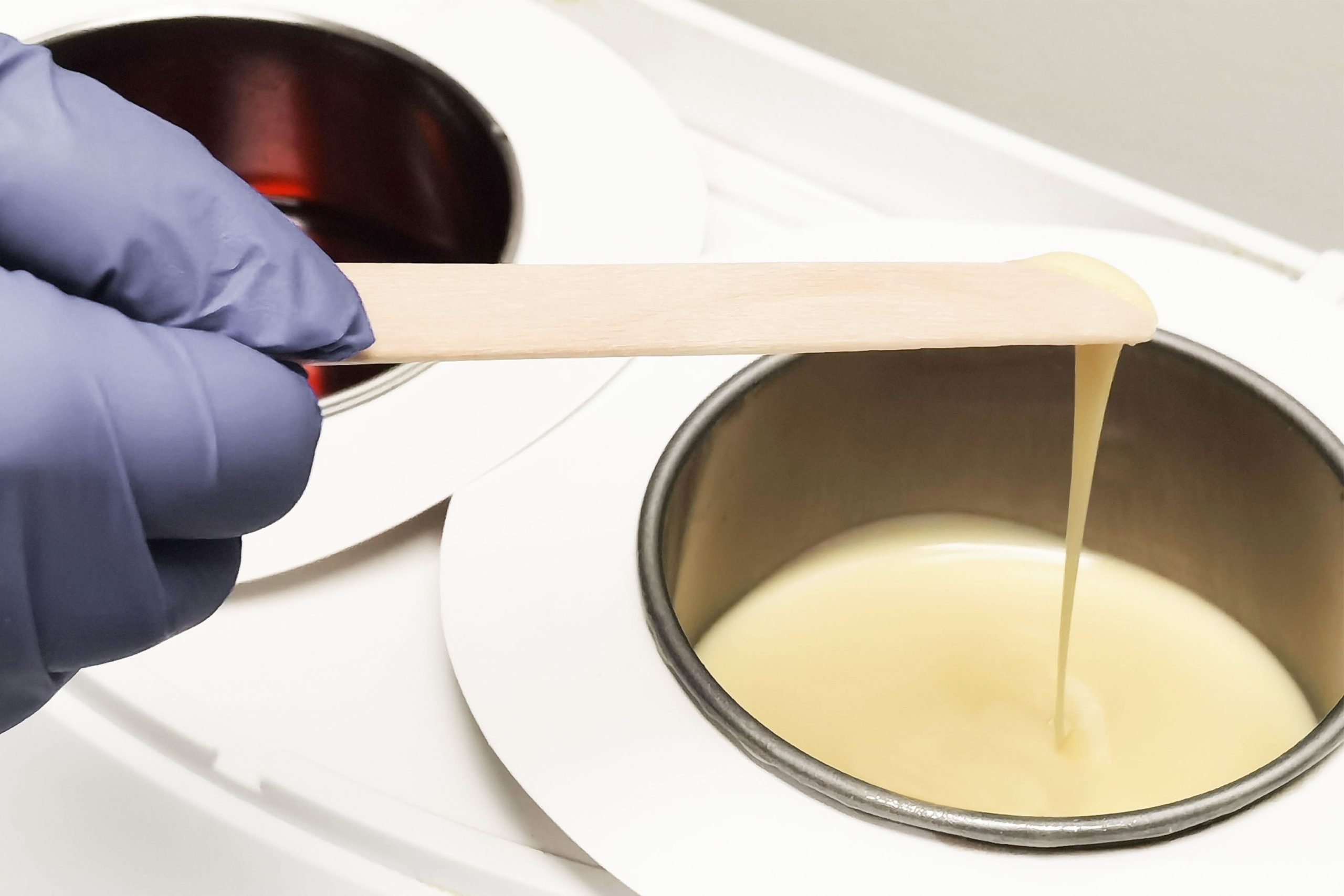 A waxing pot being used during a waxing service winnipeg